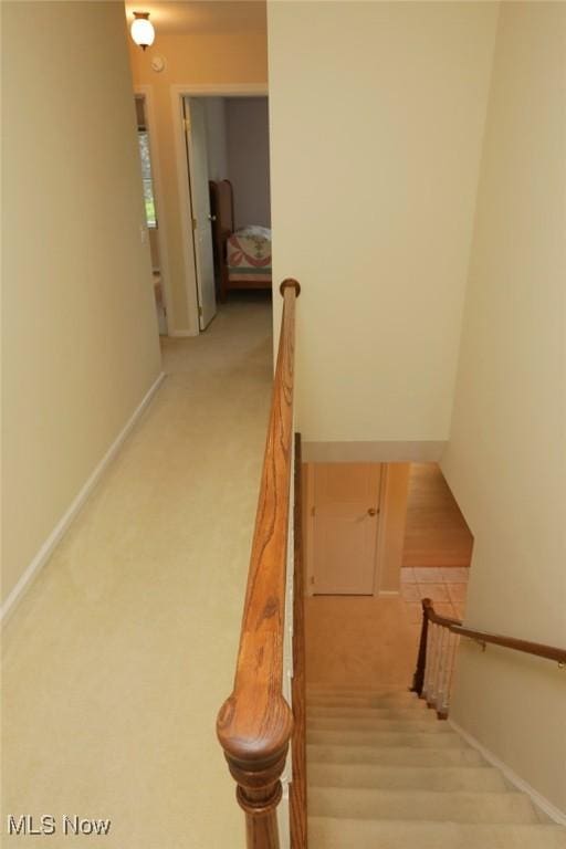 stairway featuring baseboards