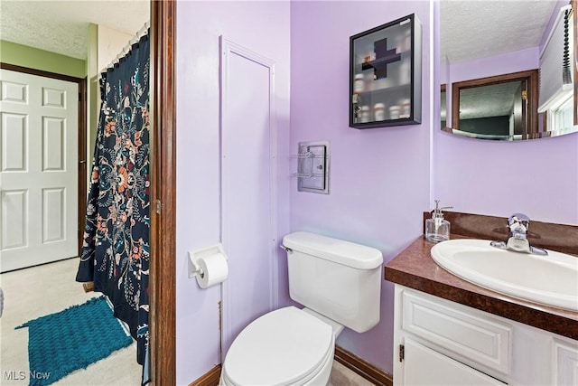 full bath featuring toilet, a shower with curtain, a textured ceiling, and vanity