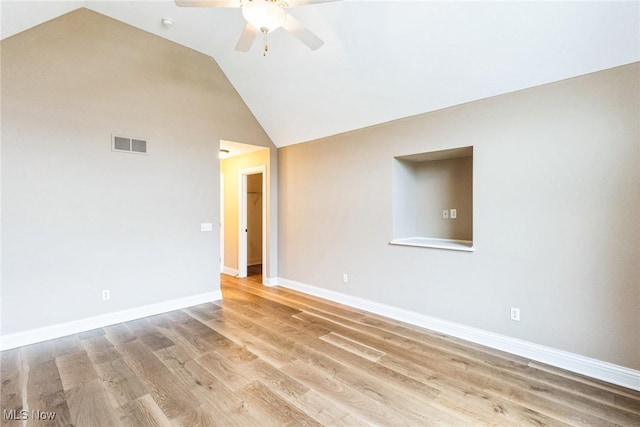 unfurnished room featuring high vaulted ceiling, a ceiling fan, visible vents, baseboards, and light wood-type flooring