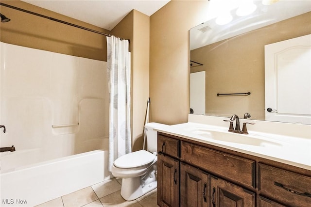 bathroom with visible vents, toilet, shower / bath combo with shower curtain, vanity, and tile patterned flooring