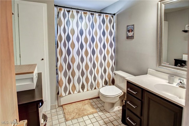 full bathroom featuring toilet, tile patterned flooring, shower / bath combination with curtain, and vanity