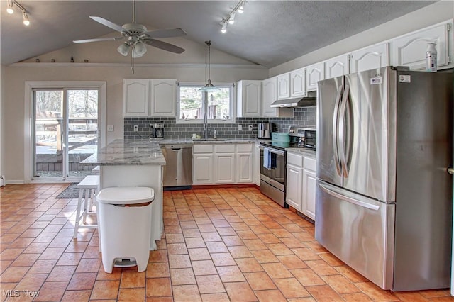 kitchen with backsplash, appliances with stainless steel finishes, white cabinetry, a peninsula, and under cabinet range hood