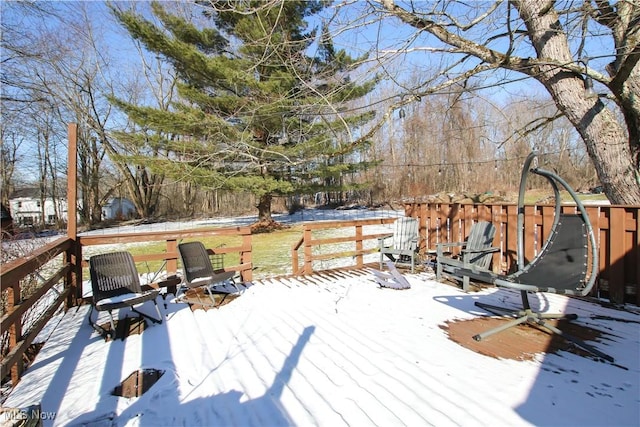 view of snow covered deck