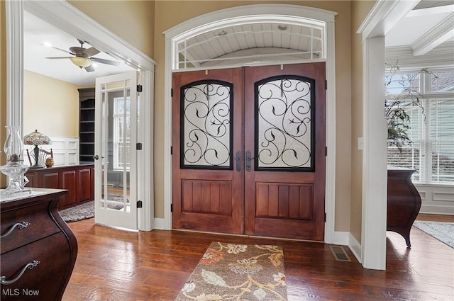 foyer entrance with hardwood / wood-style flooring, visible vents, baseboards, a ceiling fan, and french doors