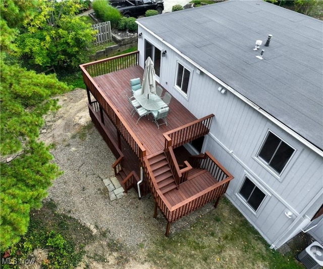 wooden terrace featuring cooling unit