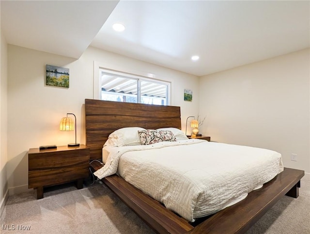 carpeted bedroom featuring recessed lighting and baseboards