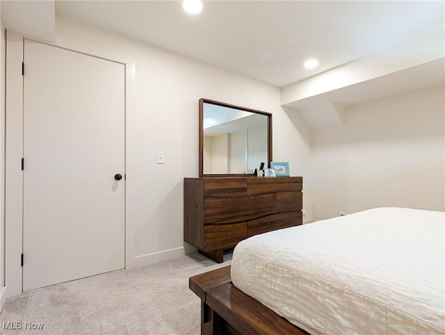 bedroom with recessed lighting, baseboards, and carpet