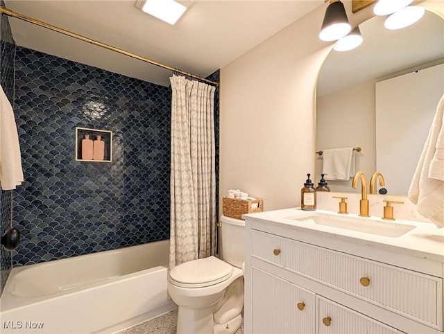 full bathroom featuring speckled floor, vanity, toilet, and shower / tub combo with curtain