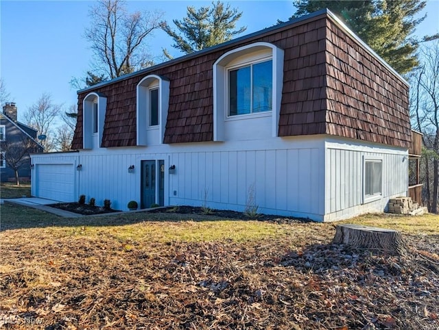 view of front of home with mansard roof