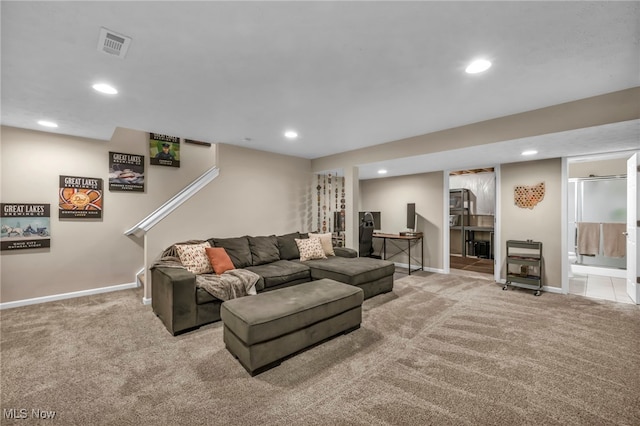 carpeted living room with baseboards, visible vents, and recessed lighting