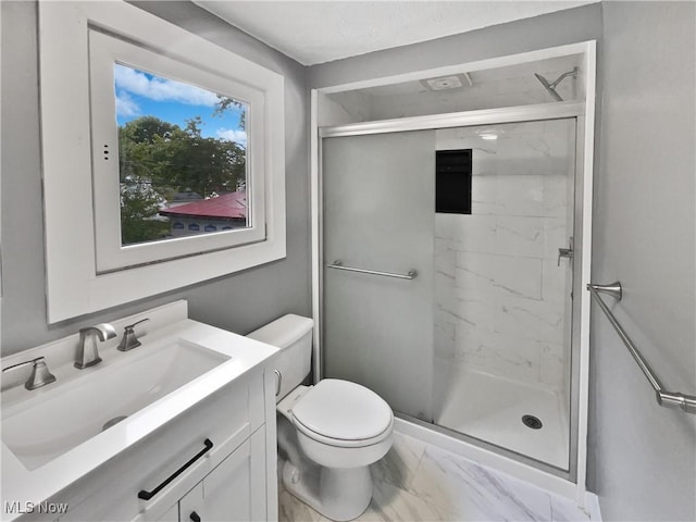 full bath featuring marble finish floor, toilet, vanity, and a marble finish shower