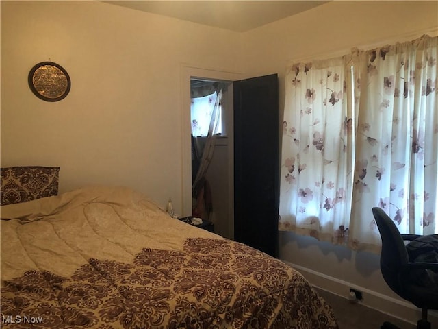 bedroom featuring baseboards