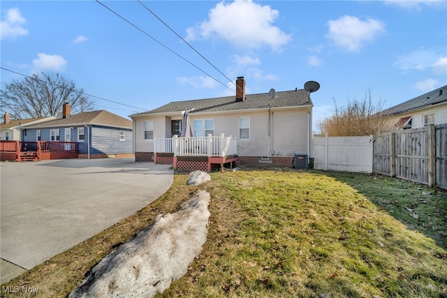 back of property with central air condition unit, a patio area, fence, and a wooden deck