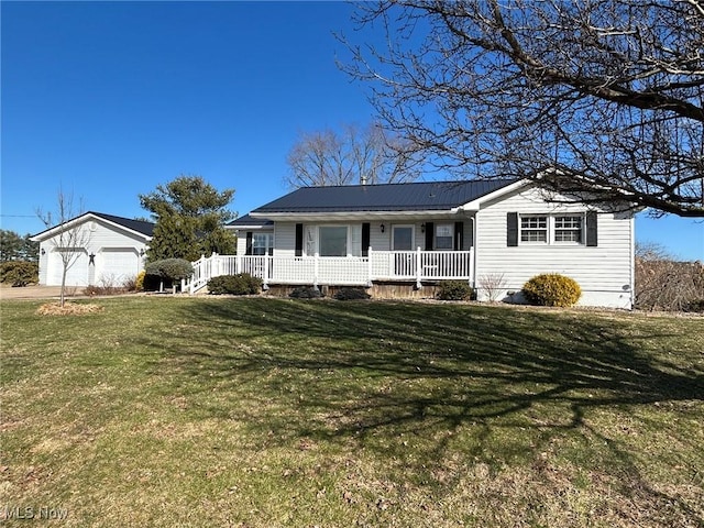 ranch-style house with a porch, a front yard, metal roof, and a garage