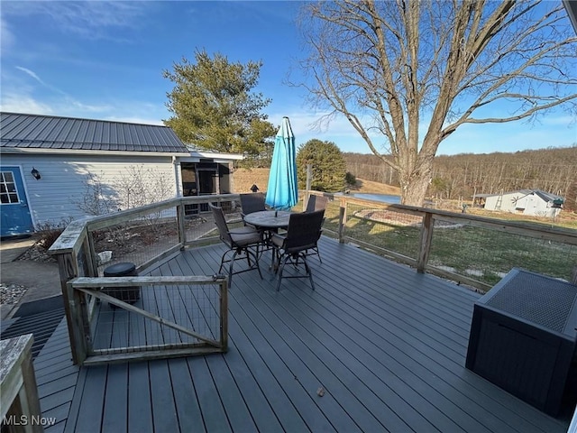 wooden deck with outdoor dining area