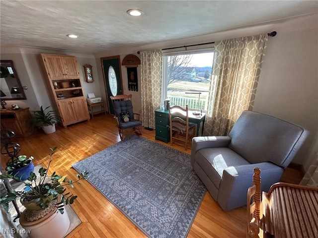 sitting room with recessed lighting and light wood-style floors