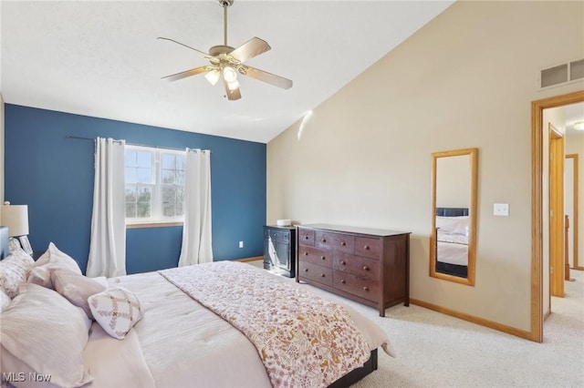 carpeted bedroom with high vaulted ceiling, a ceiling fan, visible vents, and baseboards