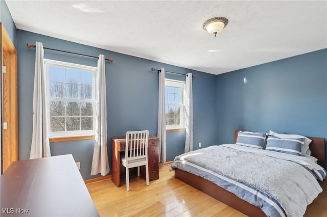 bedroom with wood finished floors