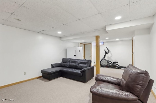 living area with recessed lighting, carpet, a paneled ceiling, and baseboards