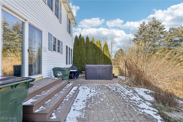 exterior space featuring a hot tub