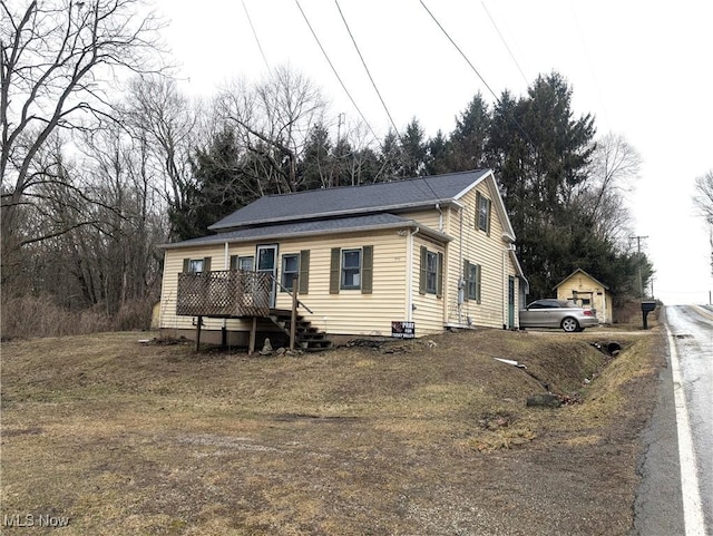 view of front of property featuring a wooden deck