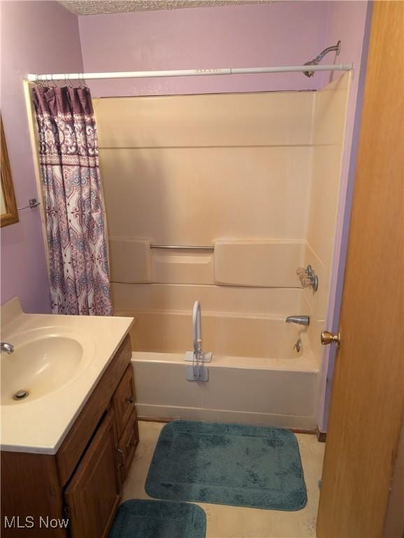 full bathroom featuring shower / tub combo with curtain and vanity