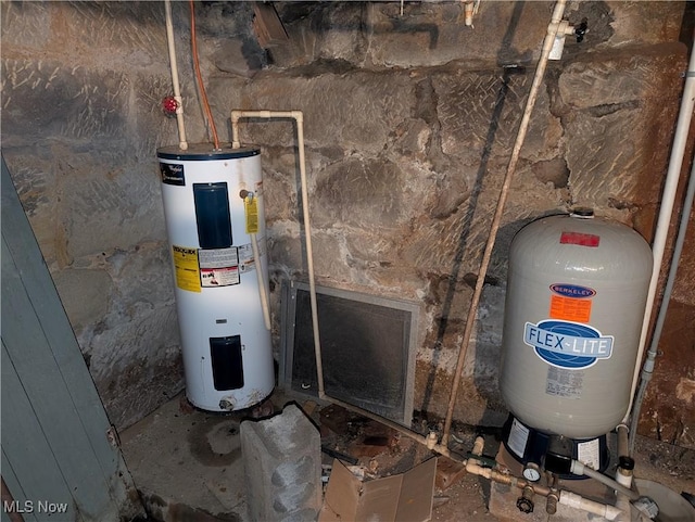 utility room featuring water heater