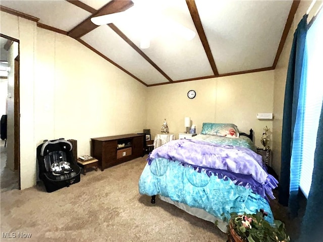 bedroom with vaulted ceiling with beams, carpet floors, and crown molding