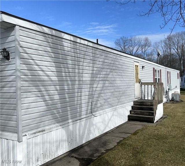 view of side of home featuring a yard