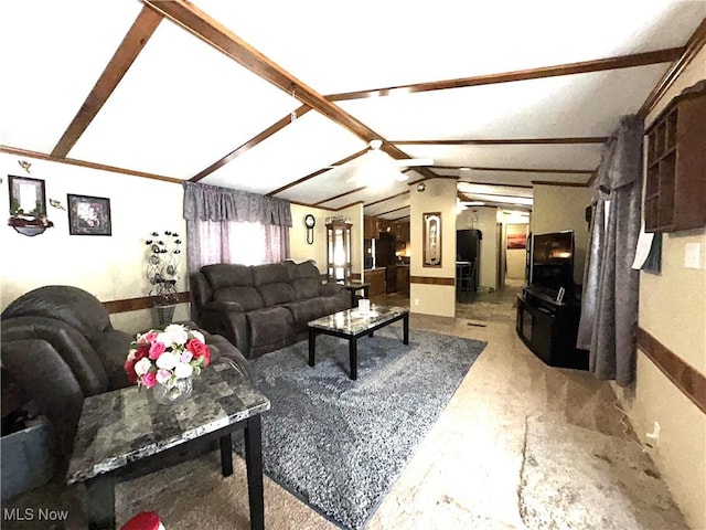 living area featuring vaulted ceiling