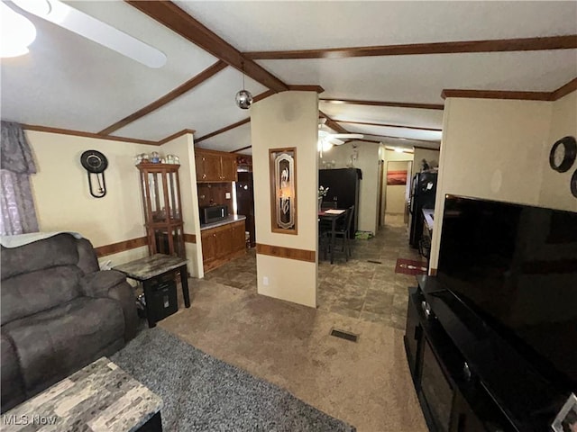 carpeted living area with a ceiling fan, visible vents, ornamental molding, and lofted ceiling with beams