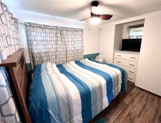 bedroom featuring ceiling fan and wood finished floors