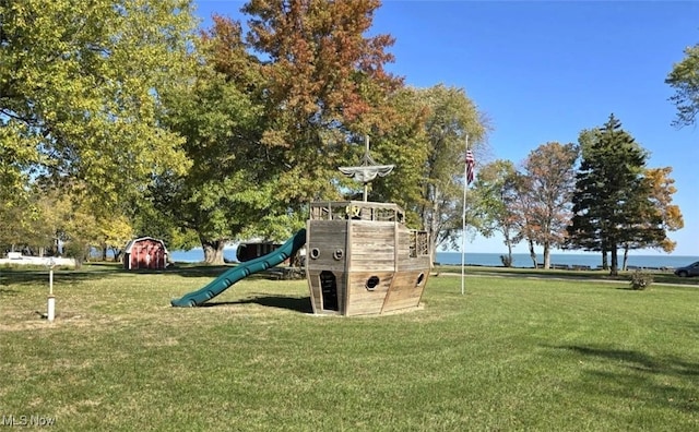 community jungle gym with a lawn