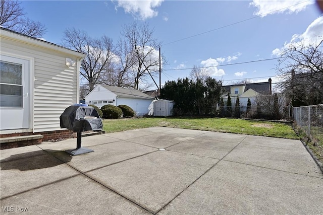 view of patio / terrace featuring an outbuilding, fence, and entry steps