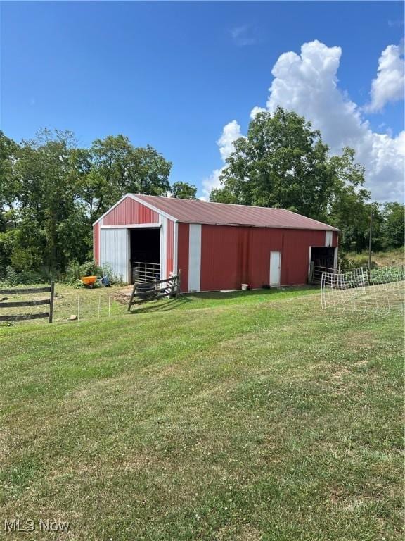 view of pole building with a yard