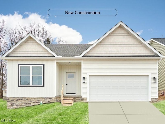 ranch-style home with a garage, driveway, roof with shingles, and a front yard