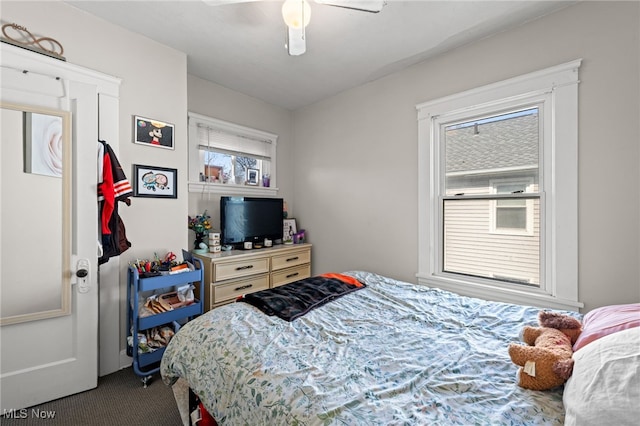 carpeted bedroom with a ceiling fan