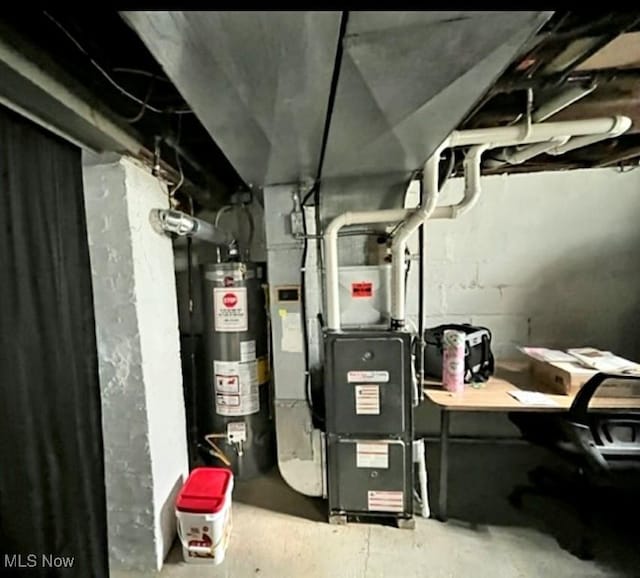 utility room with water heater and heating unit