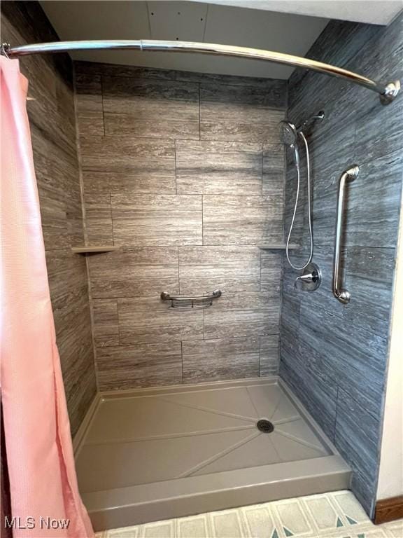 full bath featuring a shower stall