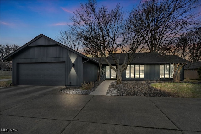 view of front of property featuring driveway and an attached garage