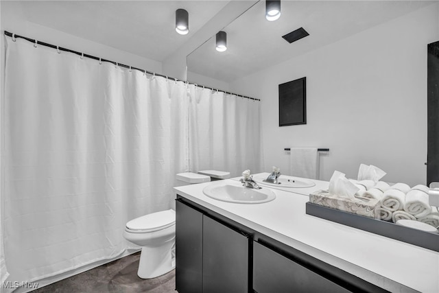 bathroom with vanity and toilet