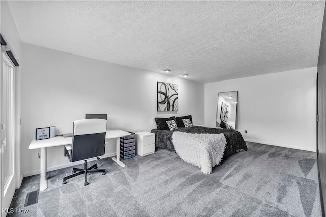 bedroom featuring carpet floors, visible vents, and baseboards