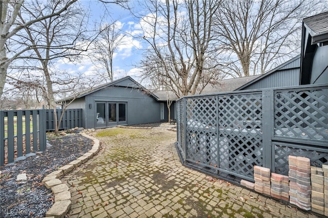 view of yard with a fenced backyard and a patio