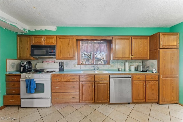 kitchen with black microwave, a sink, stainless steel dishwasher, white gas range oven, and brown cabinetry