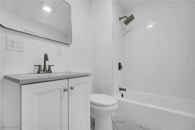 bathroom with marble finish floor, tub / shower combination, vanity, and toilet