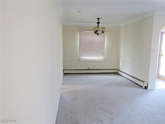 empty room featuring ornamental molding, carpet flooring, and an inviting chandelier