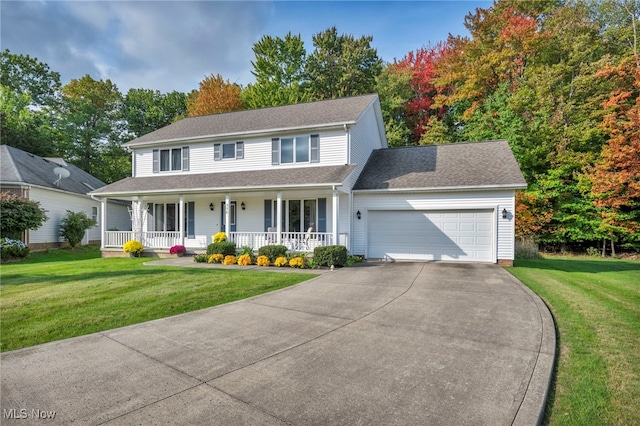 view of front of home featuring a porch, a shingled roof, concrete driveway, a front yard, and a garage