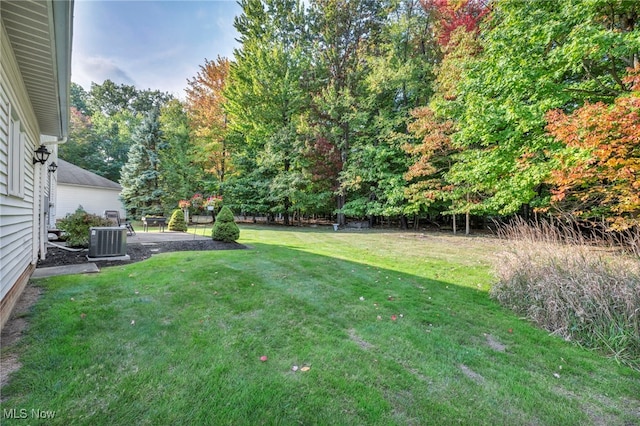 view of yard with a patio area and central AC