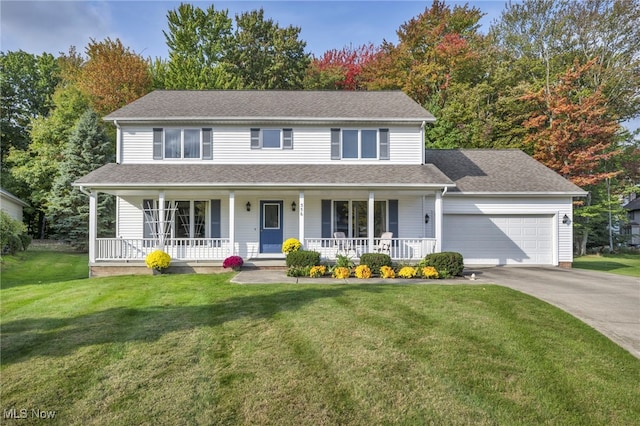 view of front facade with a porch, a shingled roof, an attached garage, a front yard, and driveway