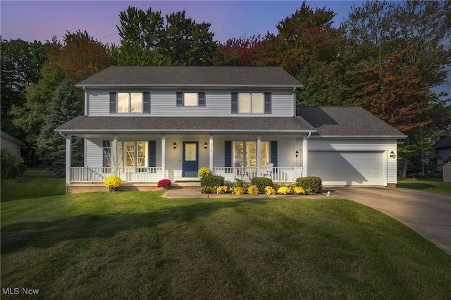 view of front of home featuring driveway, a shingled roof, an attached garage, a yard, and a porch